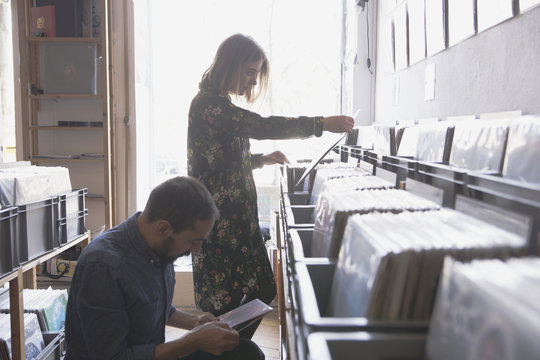 Young couple shopping for records together
