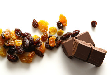 Raisins / A raisin is a dried grape. Raisins are produced in many regions of the world and may be eaten raw or used in cooking, baking, and brewing