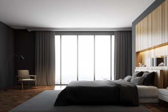 Gray and wooden bedroom interior, window