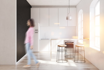 Scandinavian kitchen interior, fridge, woman