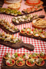 Many different snacks on beautiful boards