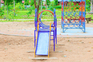 old slide playground traditional metal in school children countryside