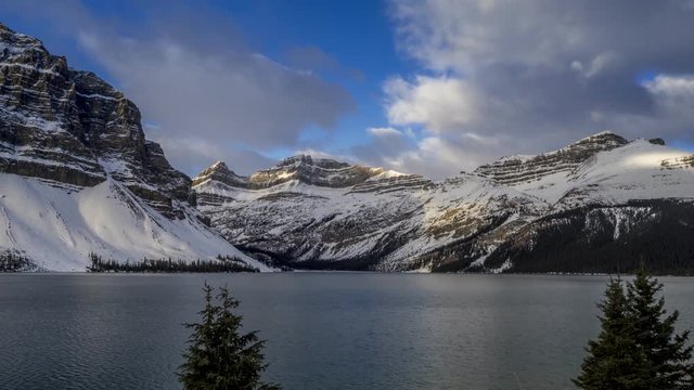 Time lapse of clouds blowing over a mountain peak along Bow Lake in Banff National Park.