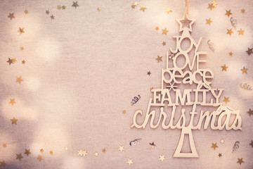 Christmas tree with love joy peace words, holidays copy space background