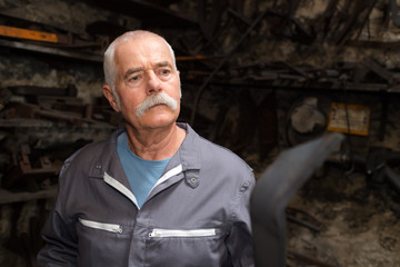 Senior man in workshop