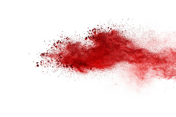 Explosion of red powder isolated on white background.