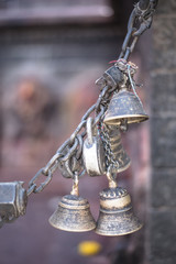 Bronze and copper made small bells locked together with a chain