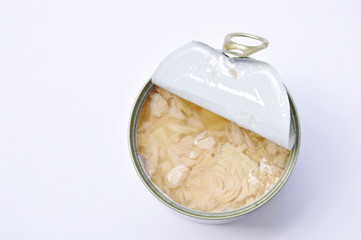 tuna in oil can food opened cover on white background