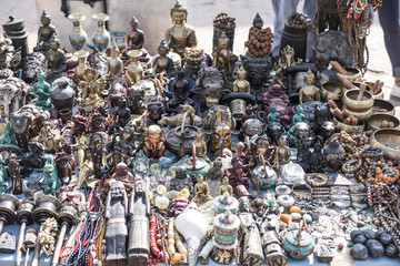 Small statues, necklaces and other souvenir items on sale at street marketplace