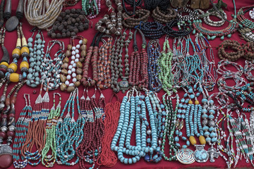 Traditional souvenir necklaces and hand bands in nepalese marketplace