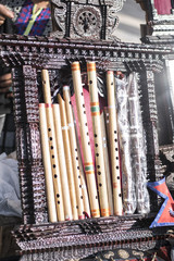 Different sized Bamboo flutes in a row