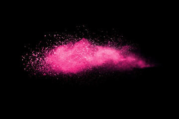 Freeze motion of colored powder explosions isolated on black background