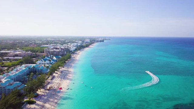 drone footage of seven mile beach in the tropical paradise of the cayman islands