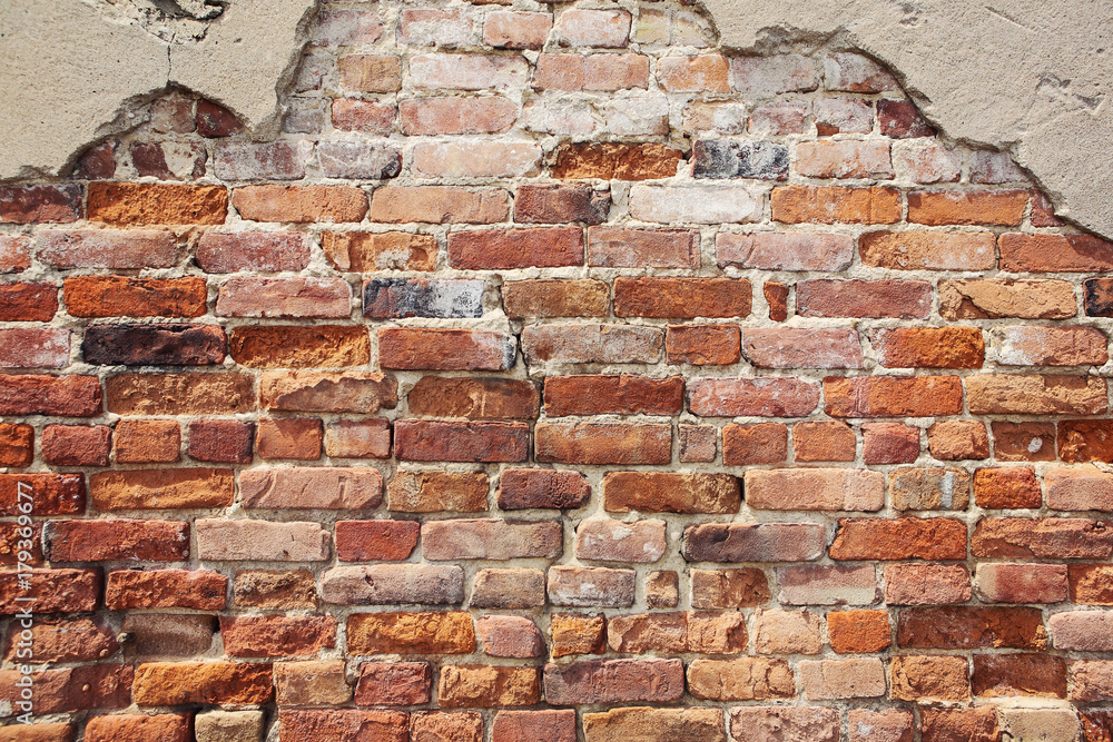 Wall mural Old crumbling brick wall