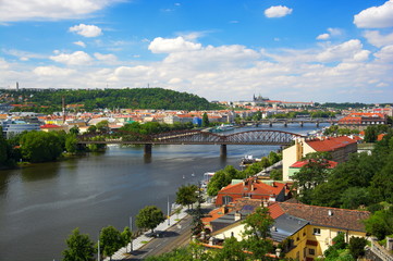 Fototapeta na wymiar Prague Viewn on Vltava river and old railway bridge.