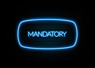 Mandatory  - colorful Neon Sign on brickwall
