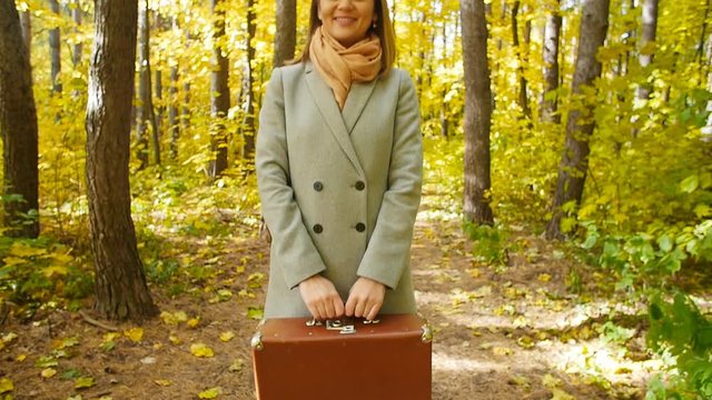 Beautiful fashion woman in autumn park