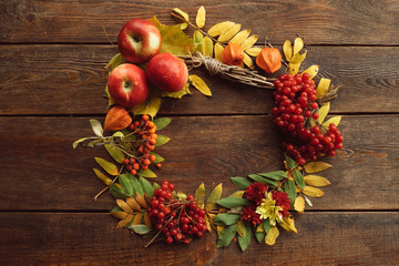 Autumn bouquet ripe wreath wood surface concept. Colourful fall background.