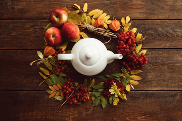 Autumn bouquet ripe warm tea wreath wood surface concept. Colourful fall background. Disease prevention