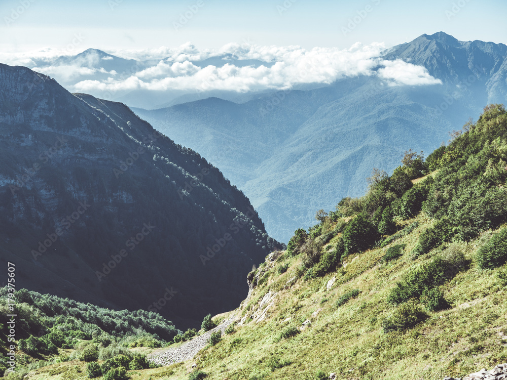 Poster clouds over the mountains