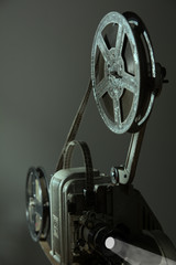 Old cinema projector on a dark background