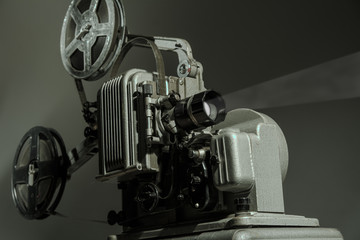 Old cinema projector on a dark background