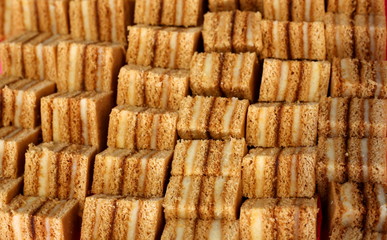 Background with multiple rows of delicious cakes