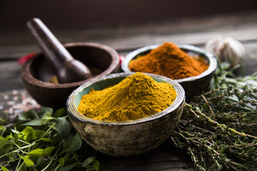 Herbs and spices on a wooden board