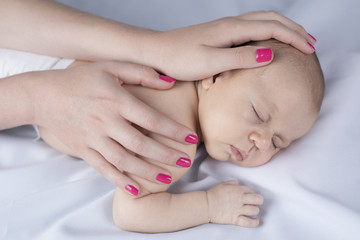 Cute newborn baby hand holding mother
