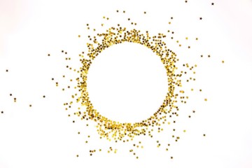 Star shaped golden sequins frame arranged in circle.