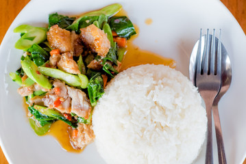 Stir fried kale and crispy pork with rice, Thai food