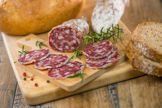 French salami Sausage on a wooden table