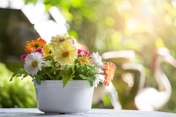 Bouquet in a white pot on a table