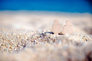 romantic symbol of man and woman on the beach 