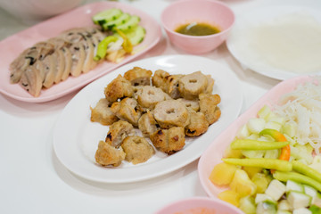 Grilled pork balls serve with fresh vegetables, rice papers, condiments and Peanut Sauce or Nam Neung, Vietnamese Meatball Wraps, Vietnam food, Thai food
