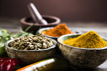 Spices on wooden bowl background 