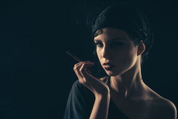 girl smoking cigarette in mouthpiece, vintage.