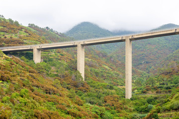 Tall railway in mountains above city. Riomaggiore, Italy