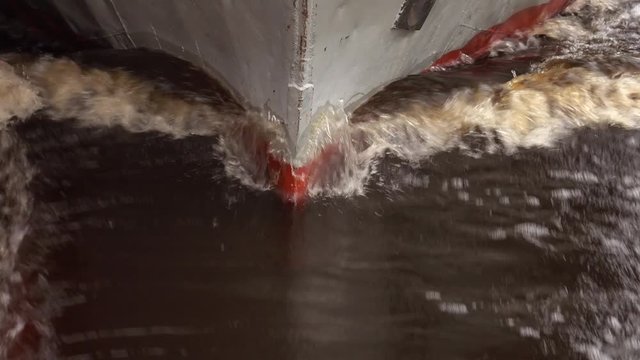 The bow of a ship on a wave.