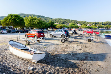 Unloading small motor boats in sea water