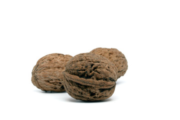 Three walnuts on white background 