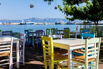 Early morning traditional colorful tavern restaurant by the harbor