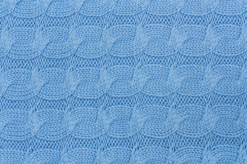 Texture of blue knitted woolen fabric for background