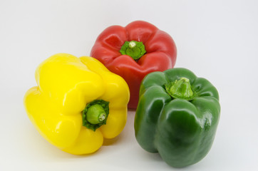 Pepper green yellow red on white background