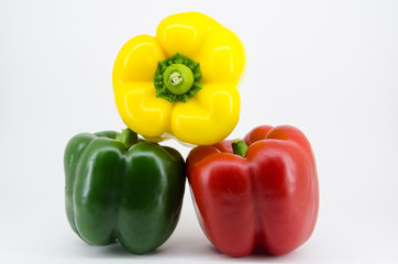 Pepper green yellow red on white background