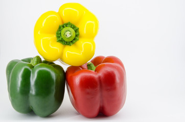 Pepper green yellow red on white background