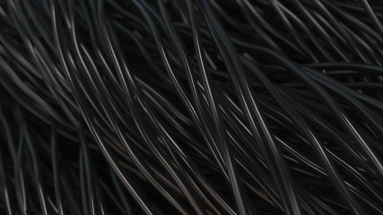 Twisted black cables and wires on black surface