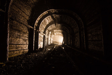 Obraz premium wooden timbering tunnel gallery drift at underground ore mine shaft