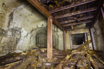 Fototapeta na wymiar Underground abandoned old mine shaft iron copper gold ore tunnel gallery with metal stands timbering