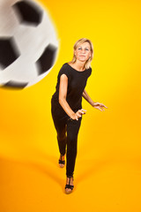 Fototapeta na wymiar woman playing with a soccer ball